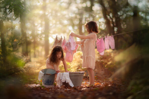 Canon fine art fall portrait of two little girls doing the laundry in an autumn forest just like in the old days by Willie Kers copy
