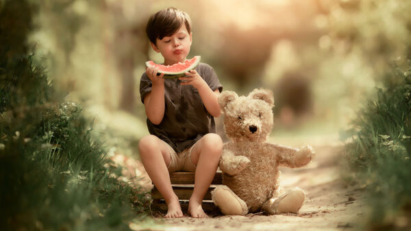 16 Canon Fine art spring portrait of a young boy eating a water melon in the forest by Dutch photographer Willie Kers